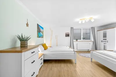 Ein Bett oder Betten in einem Zimmer der Unterkunft CASARiNA - Alpentraum am Barmsee - FeWo Lugge