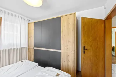 Ein Bett oder Betten in einem Zimmer der Unterkunft CASARiNA - Alpentraum am Barmsee - FeWo Lugge