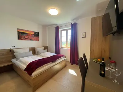 Ein Bett oder Betten in einem Zimmer der Unterkunft Gästehaus Eicherhof