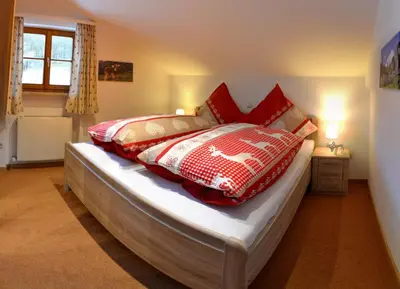 Ein Bett oder Betten in einem Zimmer der Unterkunft Haus Sonnbichl