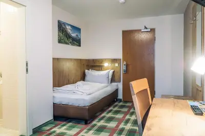 Ein Bett oder Betten in einem Zimmer der Unterkunft Gasthaus Kampenwand