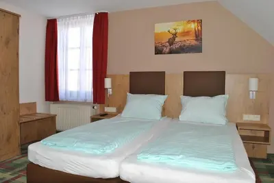 Ein Bett oder Betten in einem Zimmer der Unterkunft Gasthaus Kampenwand