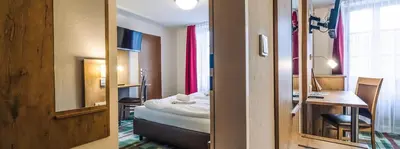 Ein Bett oder Betten in einem Zimmer der Unterkunft Gasthaus Kampenwand