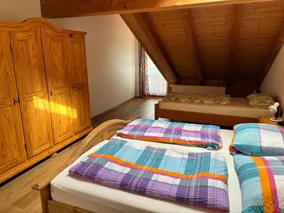Ein Bett oder Betten in einem Zimmer der Unterkunft Ferienwohnung Hamberger