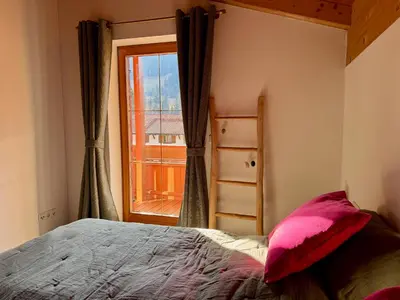 Ein Bett oder Betten in einem Zimmer der Unterkunft Ferienhaus Gollbichl
