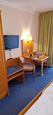 Ein Bett oder Betten in einem Zimmer der Unterkunft Studio Burghotel Aschau