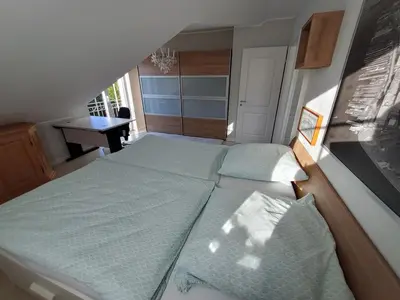 Ein Bett oder Betten in einem Zimmer der Unterkunft Schöne Wohnung Landsberg am Lech