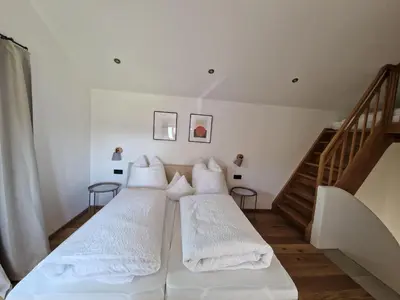 Ein Bett oder Betten in einem Zimmer der Unterkunft Bauernhofchalet Geigerhof