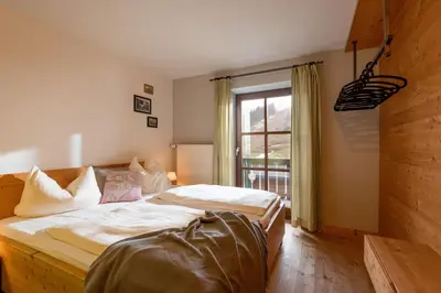 Ein Bett oder Betten in einem Zimmer der Unterkunft Almgasthof Grafenherberg