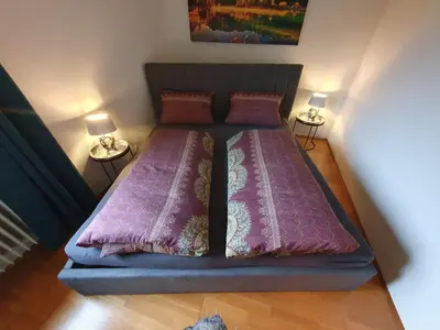 Ein Bett oder Betten in einem Zimmer der Unterkunft Ammergaufeeling mit einmaligem Bergblick und Terrasse