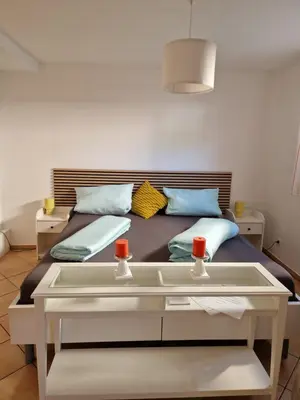 Ein Bett oder Betten in einem Zimmer der Unterkunft See-Moment-Appartment
