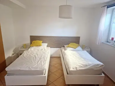 Ein Bett oder Betten in einem Zimmer der Unterkunft See-Moment-Appartment