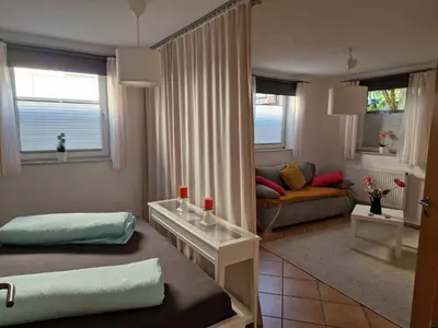 Ein Bett oder Betten in einem Zimmer der Unterkunft See-Moment-Appartment