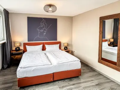 Ein Bett oder Betten in einem Zimmer der Unterkunft Geräumige Ferienwohnung mit Parkplatz direkt an der S-Bahn nach München