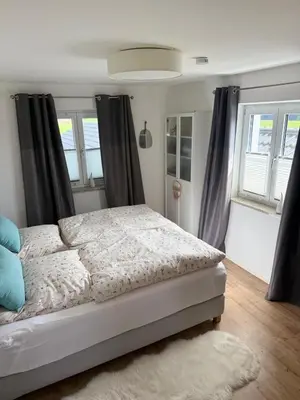 Ein Bett oder Betten in einem Zimmer der Unterkunft Moderne Ferienwohnung