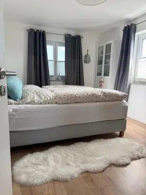 Ein Bett oder Betten in einem Zimmer der Unterkunft Moderne Ferienwohnung