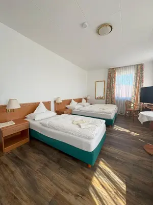 Ein Bett oder Betten in einem Zimmer der Unterkunft Hotel zum Unterwirt