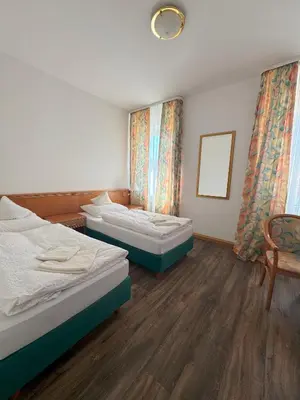 Ein Bett oder Betten in einem Zimmer der Unterkunft Hotel zum Unterwirt