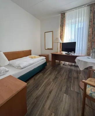 Ein Bett oder Betten in einem Zimmer der Unterkunft Hotel zum Unterwirt