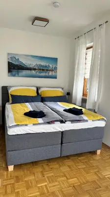 Ein Bett oder Betten in einem Zimmer der Unterkunft Alpspitzenblick