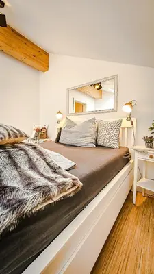 Ein Bett oder Betten in einem Zimmer der Unterkunft Modernes Alpen-Apartment nahe Neuschwanstein