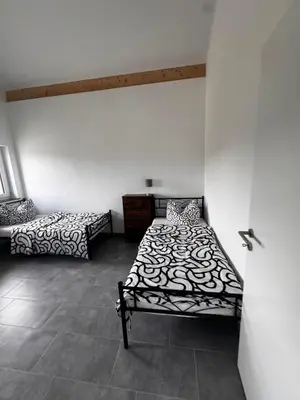 Ein Bett oder Betten in einem Zimmer der Unterkunft Bade Homes