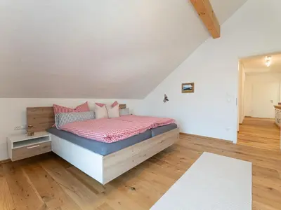 Ein Bett oder Betten in einem Zimmer der Unterkunft Ferienwohnung Anemone - 4 Zimmer mit Bergblick & Alpenflair