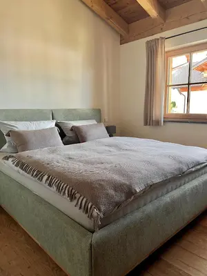Ein Bett oder Betten in einem Zimmer der Unterkunft Antdorf Chalet
