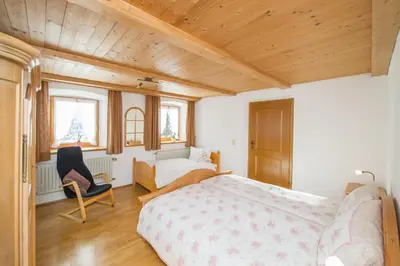 Ein Bett oder Betten in einem Zimmer der Unterkunft Nudlbichlerhof