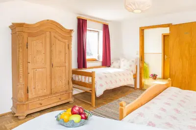 Ein Bett oder Betten in einem Zimmer der Unterkunft Nudlbichlerhof