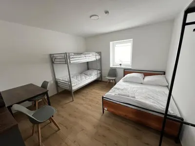 Ein Bett oder Betten in einem Zimmer der Unterkunft Smart Wohnen Dasing