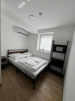 Ein Bett oder Betten in einem Zimmer der Unterkunft Smart Wohnen Dasing
