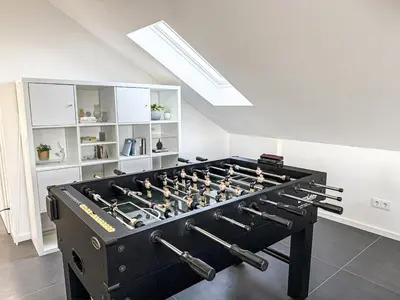 Eine Spielezimmer in der Unterkunft Studio Eleven - Loft mit Kicker