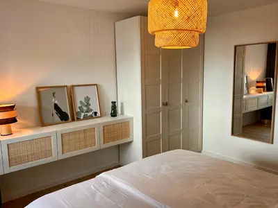 Ein Bett oder Betten in einem Zimmer der Unterkunft Olea Prien - Chiemsee Apartment