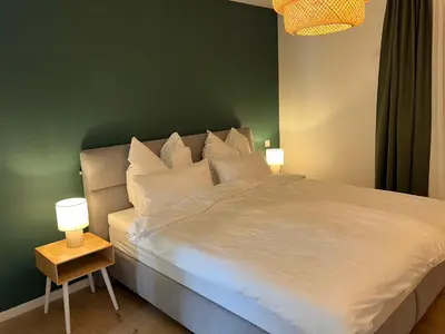 Ein Bett oder Betten in einem Zimmer der Unterkunft Olea Prien - Chiemsee Apartment