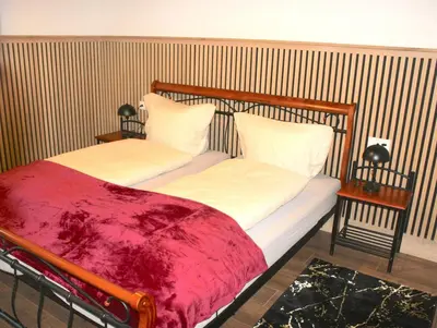 Ein Bett oder Betten in einem Zimmer der Unterkunft Dolina DeLuxe