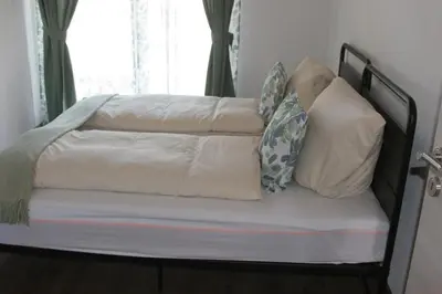 Ein Bett oder Betten in einem Zimmer der Unterkunft Dolina DeLuxe