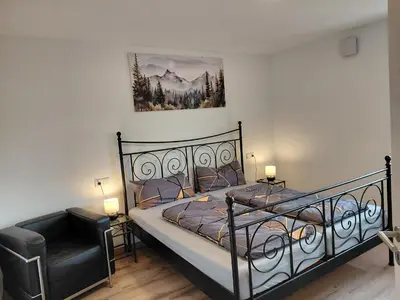 Ein Bett oder Betten in einem Zimmer der Unterkunft Ferienwohnung zum Schneiderkramer
