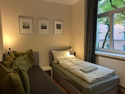 Ein Bett oder Betten in einem Zimmer der Unterkunft Hello Künstlerflair