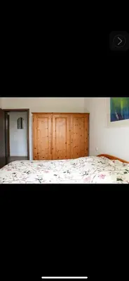 Ein Bett oder Betten in einem Zimmer der Unterkunft Idyllisches Apartment mit 2 Schlafzimmer