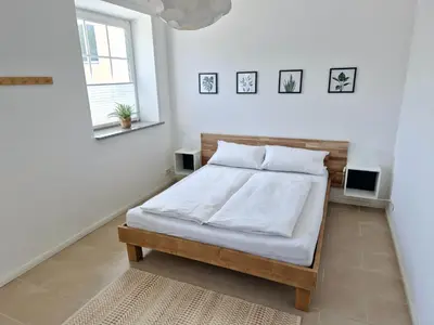 Ein Bett oder Betten in einem Zimmer der Unterkunft Suite 1 - Apartments am Schloss
