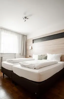 Ein Bett oder Betten in einem Zimmer der Unterkunft Ferienwohnungen Steinbacher