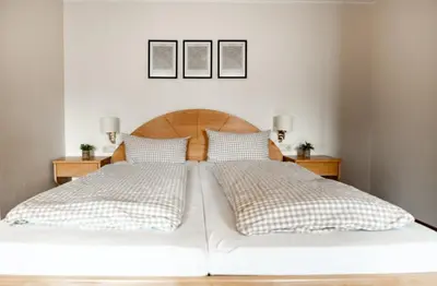 Ein Bett oder Betten in einem Zimmer der Unterkunft Ferienwohnungen Steinbacher