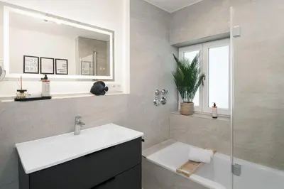 Ein Badezimmer in der Unterkunft FENJOY Ferienapartments Bernau am Chiemsee