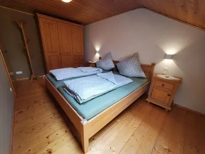 Ein Bett oder Betten in einem Zimmer der Unterkunft Biohof Dimper - HühnerNest