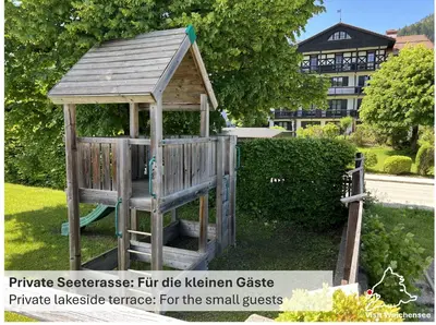 Ein Garten an der Unterkunft Seeblick Apartment am Walchensee