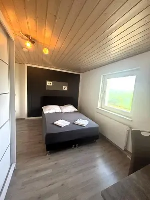 Ein Bett oder Betten in einem Zimmer der Unterkunft Bockhorn Farmhouse
