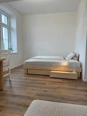 Ein Bett oder Betten in einem Zimmer der Unterkunft Living 7 Apartments