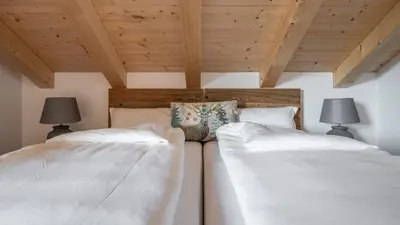 Ein Bett oder Betten in einem Zimmer der Unterkunft Alpenchalet am Hirschbach