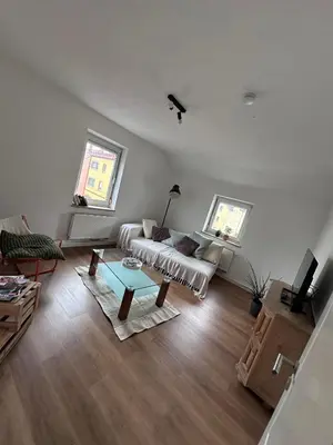 Ein Sitzbereich in der Unterkunft City Apartment Hettenbach